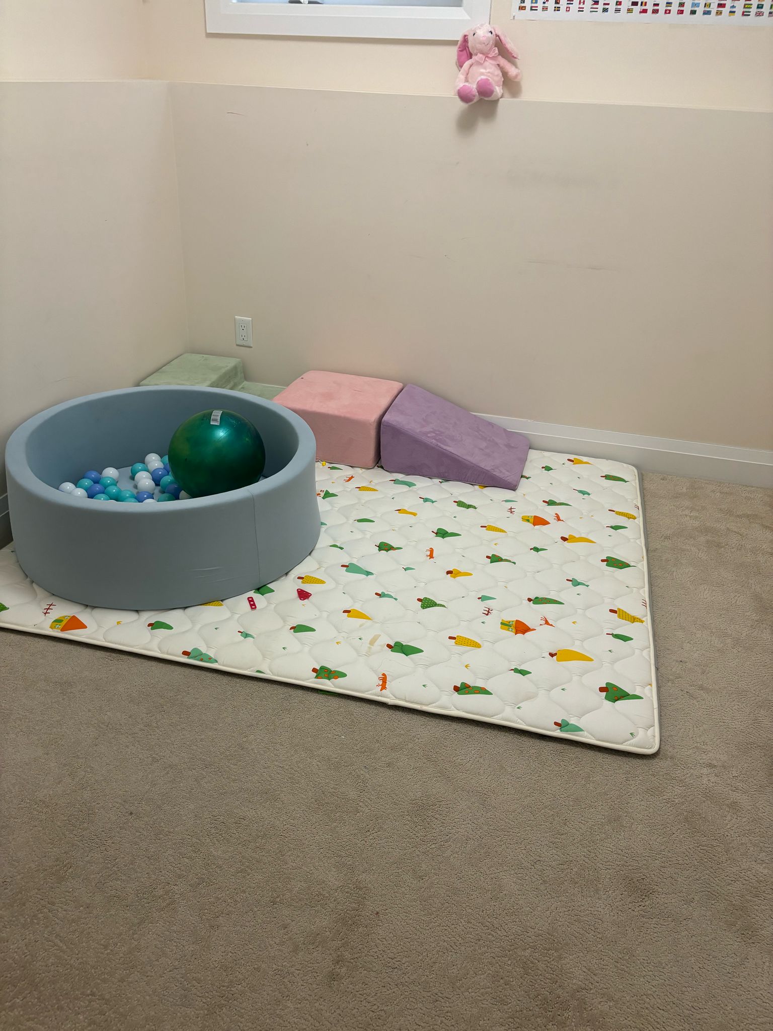 Soft ball pit and climbing wedges in our infant sensory space